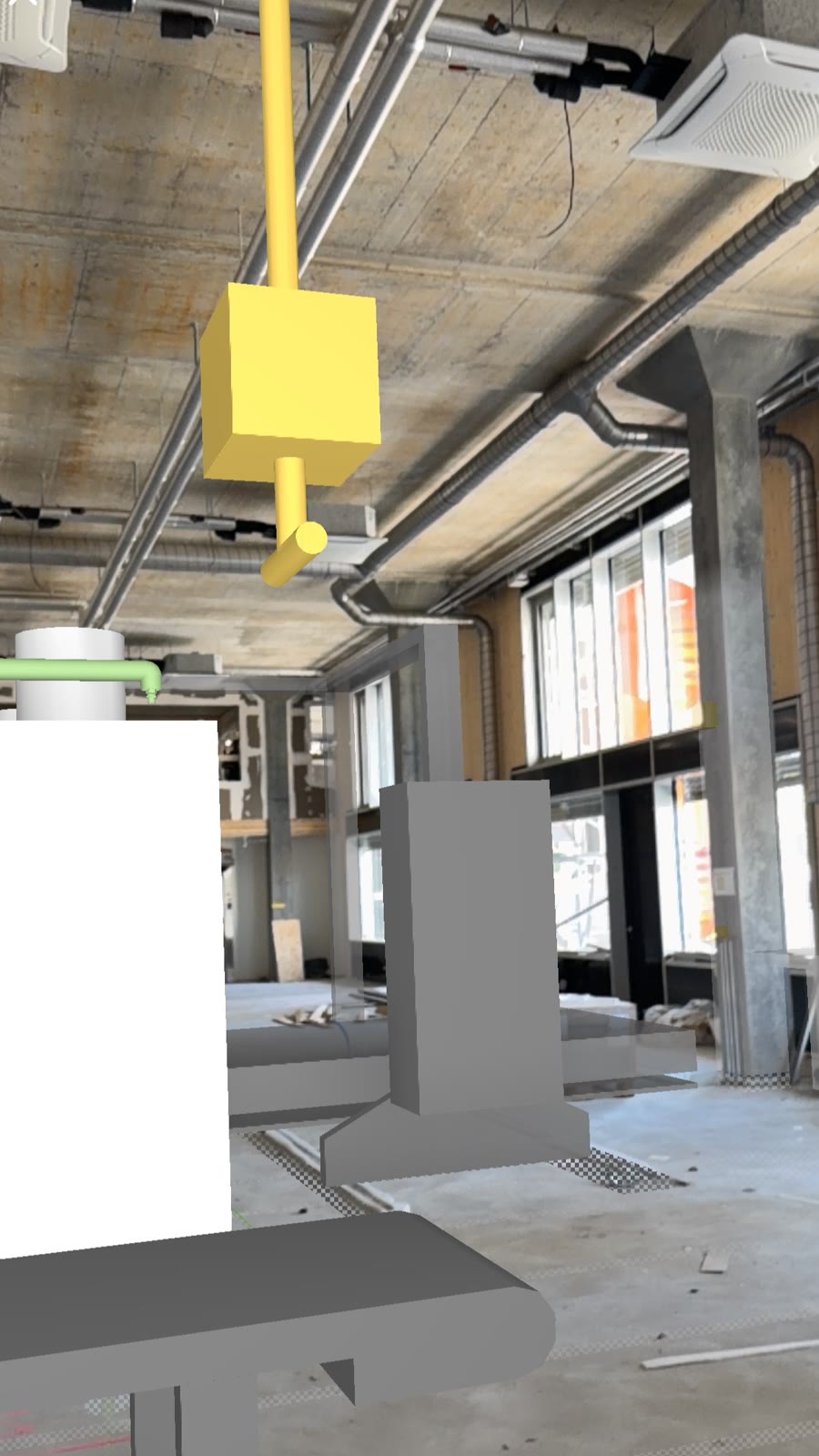 Das Gebäudetechnik-Modell als Mixed-Reality-Ansicht über der realen Baustelle