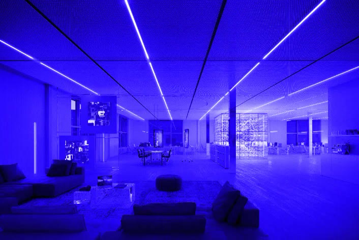 Bürolandschaft der TI&M AG mit Sitzbereich und Lichtlinien in der Decke